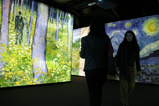 Two girls walk through installations for the new Van Gogh exhibit in Barcelona on March 14 2019 (by Pau Cortina)